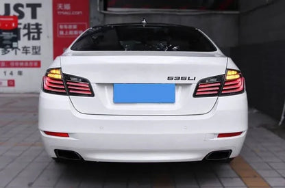 BMW 5-Series F10 clear style LED tail lights by K2 Industries, showing sleek, modern red and clear lens design for model years 2010-2017.