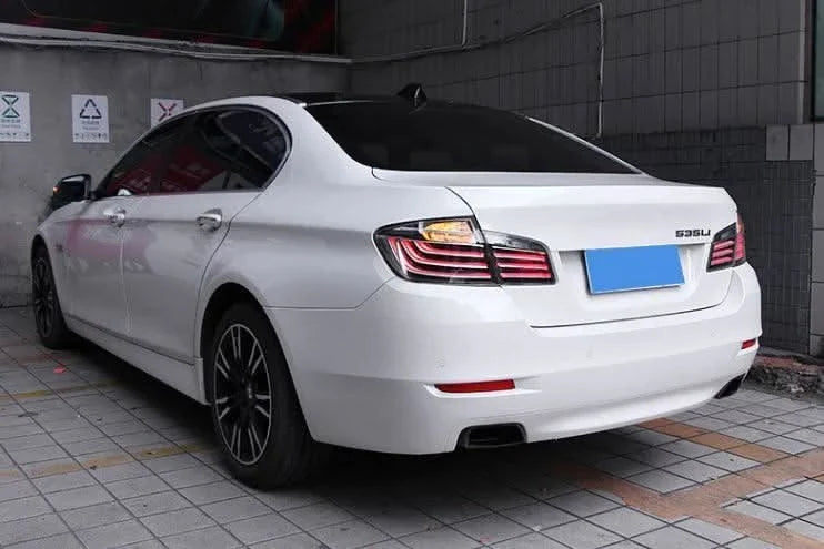 BMW 5-Series F10 clear style LED tail lights by K2 Industries, showing sleek, modern design for model years 2010 to 2017.