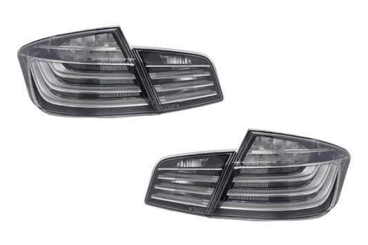 BMW 5-Series F10 clear style LED tail lights by K2 Industries, showing sleek design and bright illumination for model years 2010-2017.