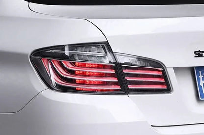 BMW 5-Series F10 clear style LED tail lights by K2 Industries, showing sleek, modern design with bright LED illumination.