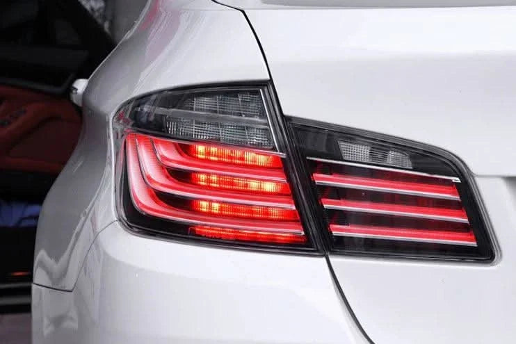 BMW 5-Series F10 clear style LED tail lights by K2 Industries, showing sleek design for 2010-2017 model.