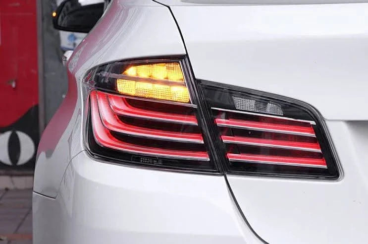 BMW 5-Series F10 clear style LED tail lights by K2 Industries, showing sleek, modern design with bright LED accents for 2010-2017.