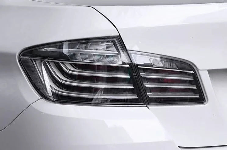 BMW 5-Series F10 clear style LED tail lights by K2 Industries, showing sleek design and modern lighting elements for model years 2010-2017.