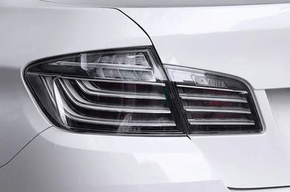 BMW 5-Series F10 clear style LED tail lights by K2 Industries, showing sleek design and modern lighting elements for model years 2010-2017.