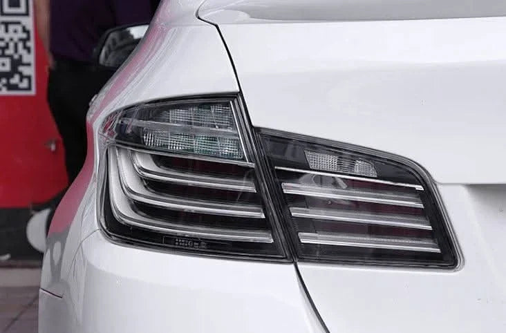 BMW 5-Series F10 clear style LED tail lights by K2 Industries, showing sleek, modern design for 2010-2017 BMW 5-Series F10 vehicles.