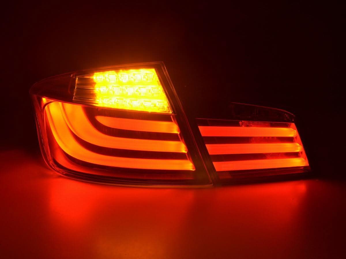 BMW 5-Series F10 sedan black LED taillights by K2 Industries, front and rear view showing sleek tail light design for 2010-2012 models.