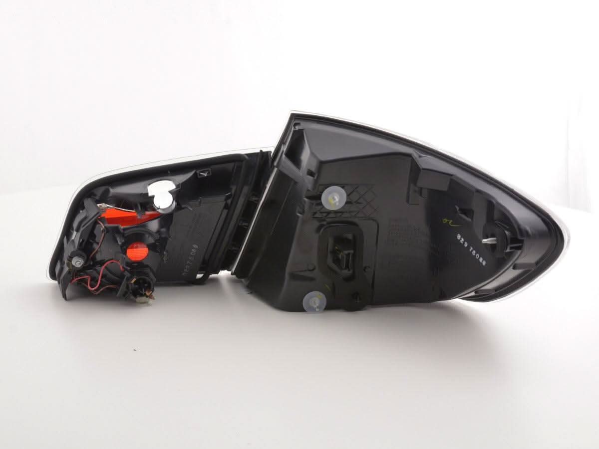 BMW 5-Series F10 sedan black LED tail lights by K2 Industries, showing sleek design and illuminated LED reverse and brake lights.