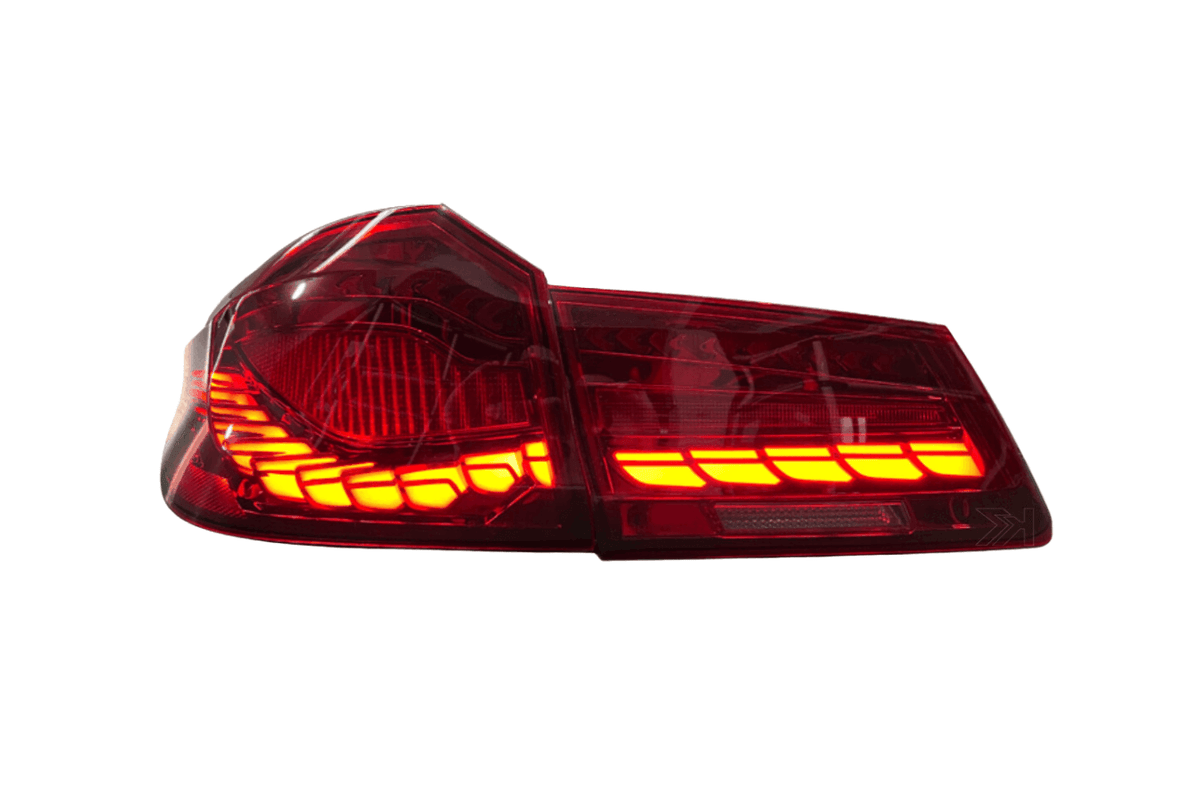 BMW 5-Series G30 G38 M5 tail lights with dragon scale OLED style by K2 Industries, installed on the rear of the vehicle.