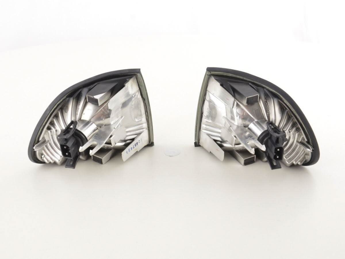 BMW 7-Series E38 smoked corner lights by K2 Industries, 1995-1999, showing close-up of black-tinted vehicle corner lights.