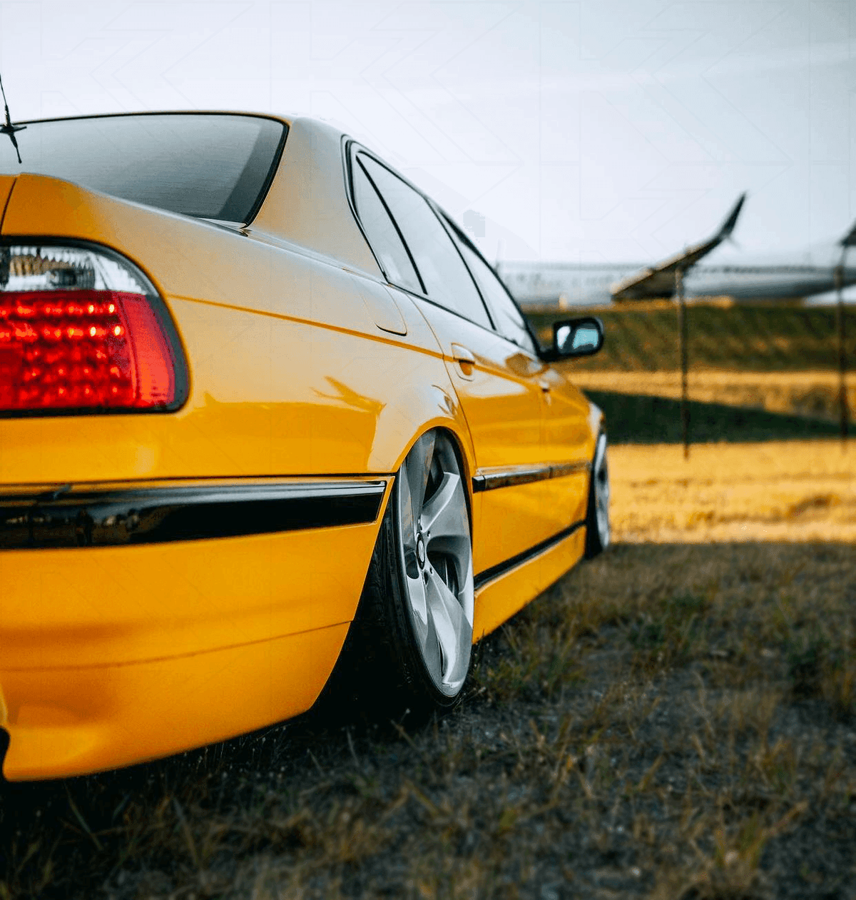 BMW 7-series E38 red LED tail lights set by K2 Industries, showing the rear view with illuminated red LEDs and clear lens covers.
