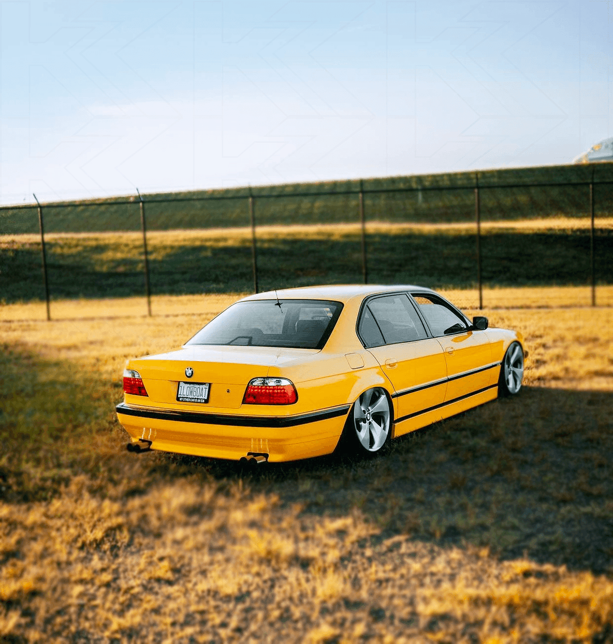BMW 7-series E38 red LED taillights set by K2 Industries, showing rear view with illuminated red LED tail lights.