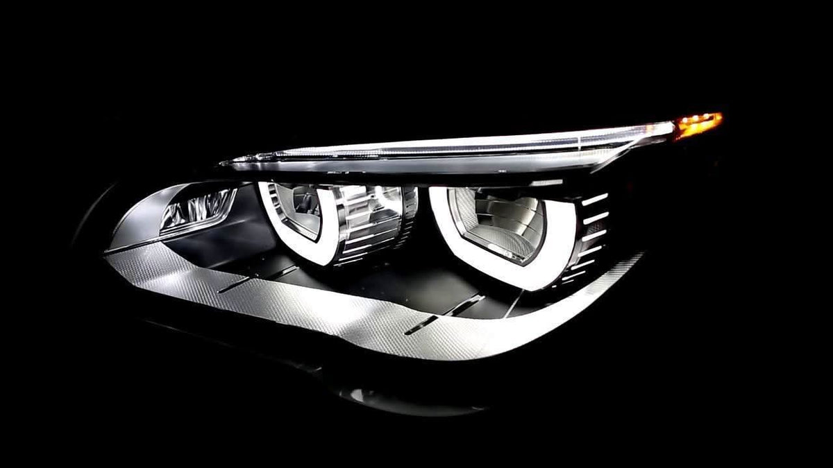 BMW 7 Series F01/F02 OE and headlight upgrade by K2 Industries, 2009-2015, showing sleek car headlights with upgraded design
