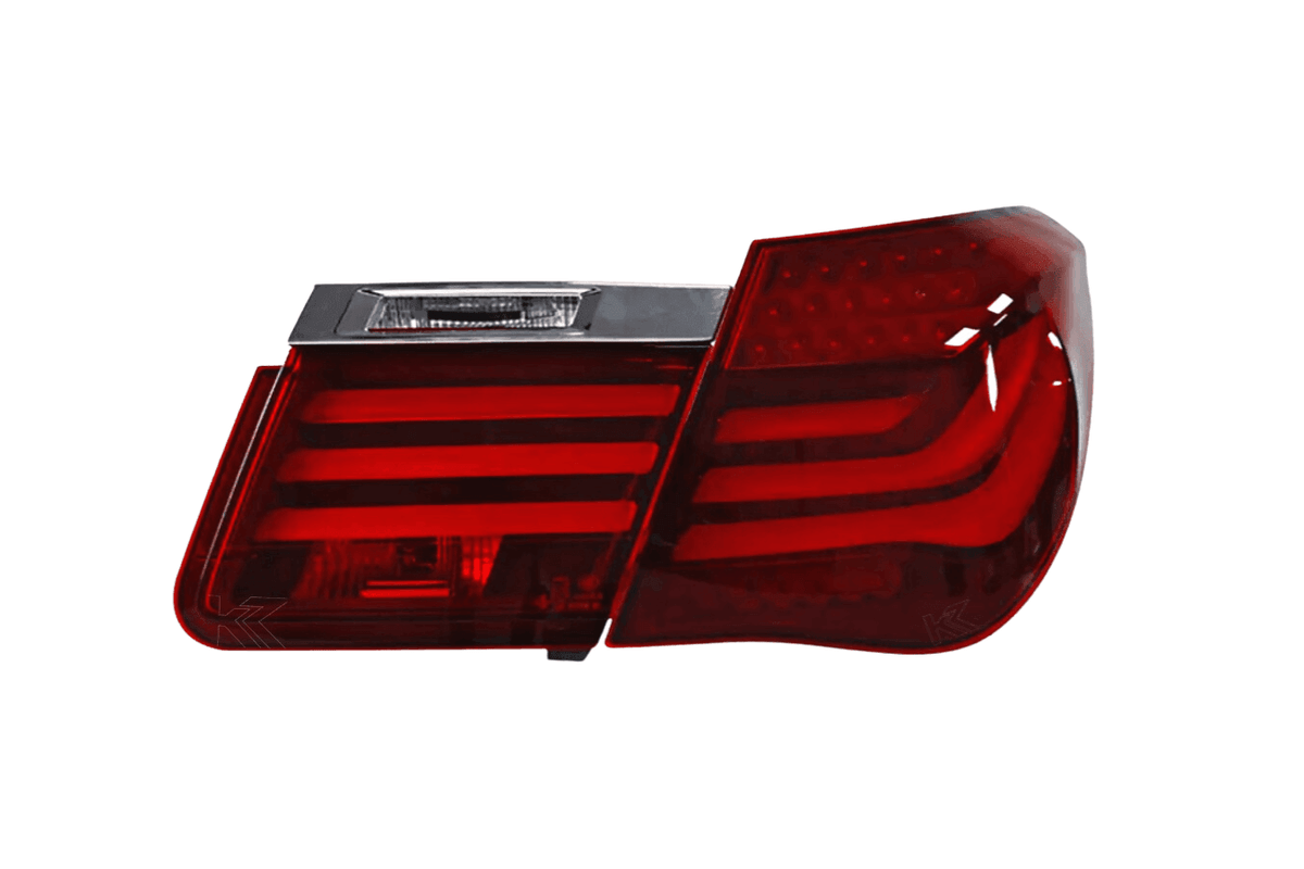 BMW 7-Series F02 red tail lights by K2 Industries, rear view showing LED lighting and sleek design for 2009-2015 models.
