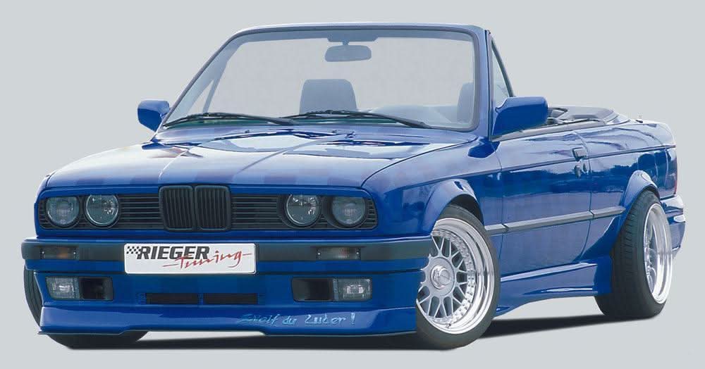 BMW E30 Coupe and Convertible Rieger "Twisty" Side Skirt Set by K2 Industries, featuring sleek, aerodynamic side skirts on a black car.