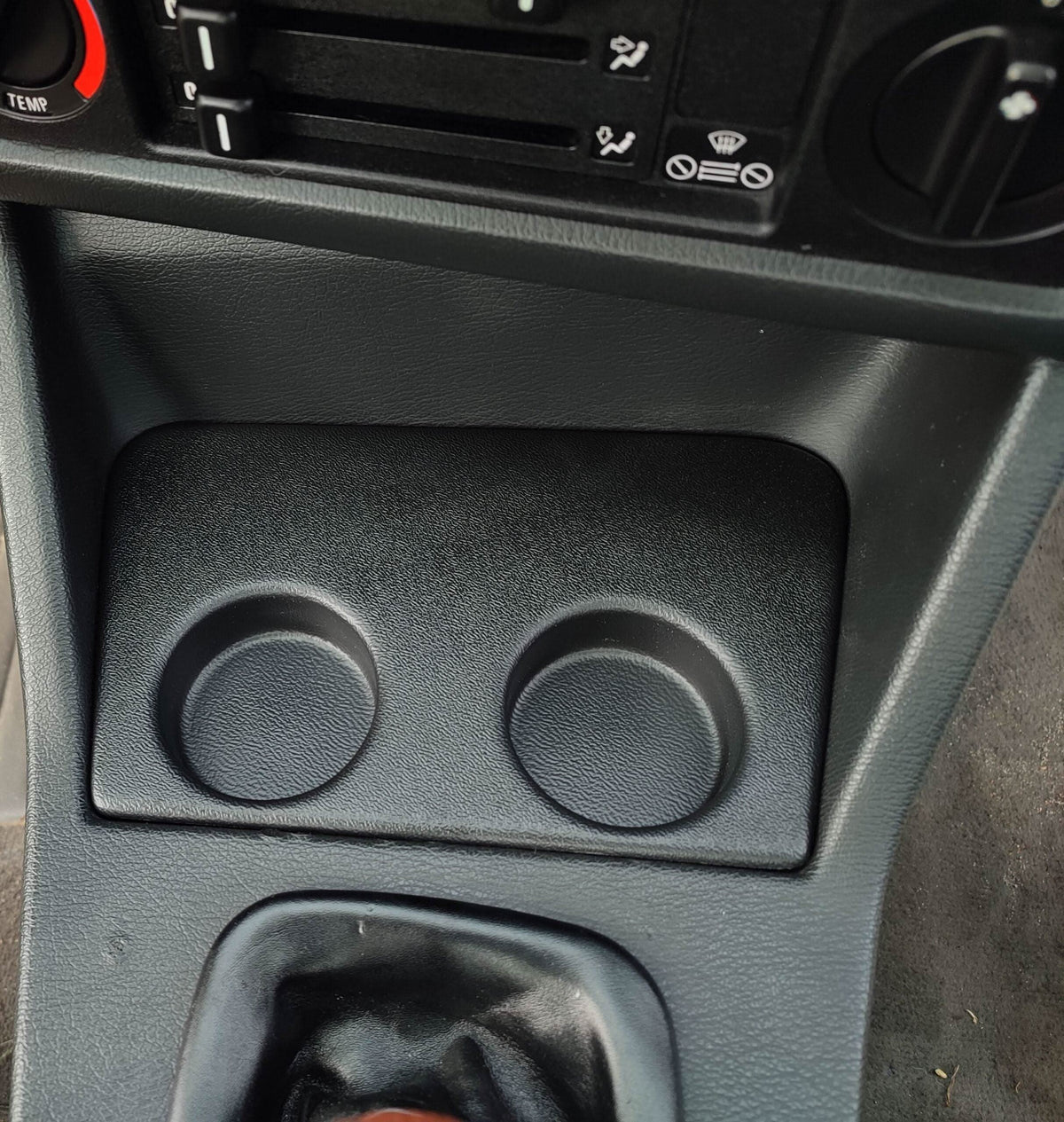 BMW E30 Modern Cup Holder V2 by K2 Industries, interior car accessory with sleek design, fits seamlessly in BMW E30 interior.