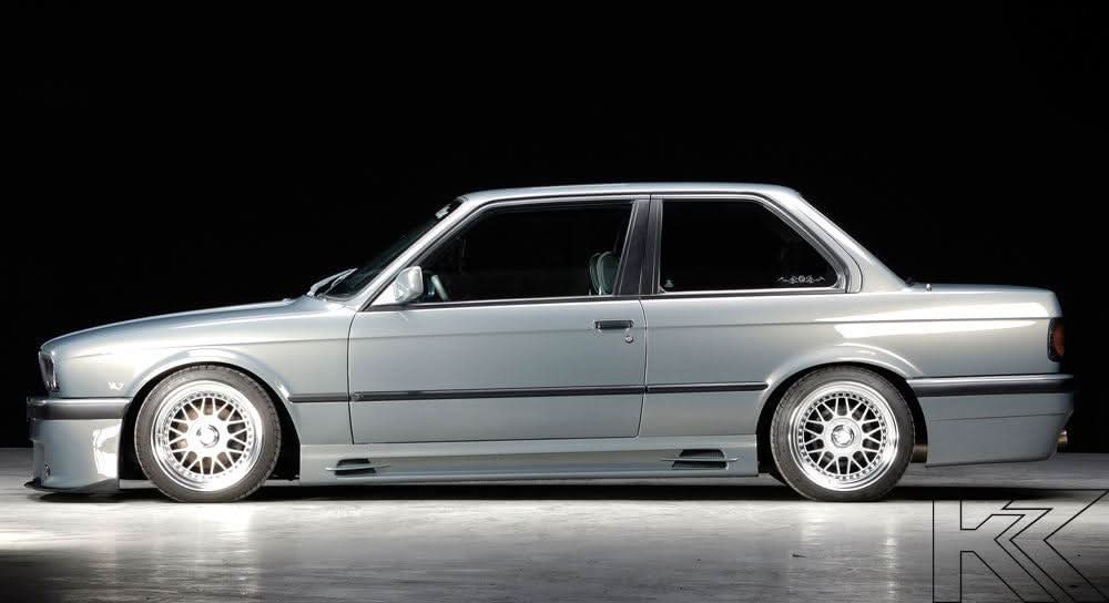 BMW E30 Rieger vented side skirts by K2 Industries, showcasing sleek, aerodynamic design for enhanced car styling.