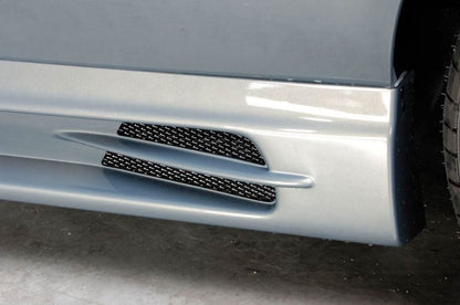 BMW E30 Rieger Side Skirts Vented Type 1 by K2 Industries, showing sleek aerodynamic design and vented side panel details.