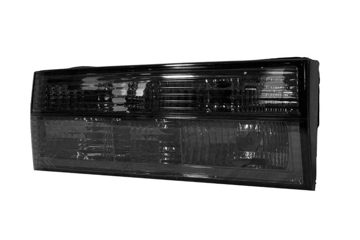 BMW E30 Series 3 pre-facelift clear and smoke LED tail lights by K2 Industries, showing sleek design and modern illumination.