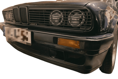 BMW E30 Series 3 headlights and front grille by K2 Industries, showing the sleek design of the 1984-1991 model.
