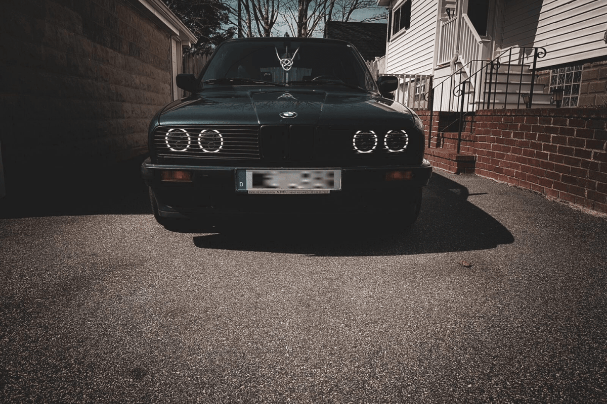BMW E30 Series 3 front grille and headlights by K2 Industries, showing the sleek headlamp design and grille details for 1984-1991.