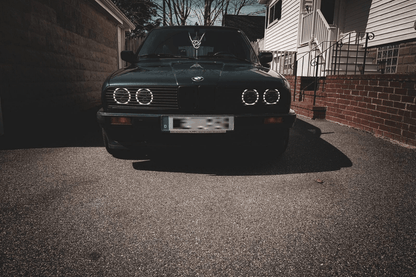 BMW E30 Series 3 front grille and headlights by K2 Industries, showing the sleek headlamp design and grille details for 1984-1991.