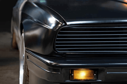 BMW E30 Series 3 headlights and front grille by K2 Industries, showcasing the classic design from 1984 to 1991.