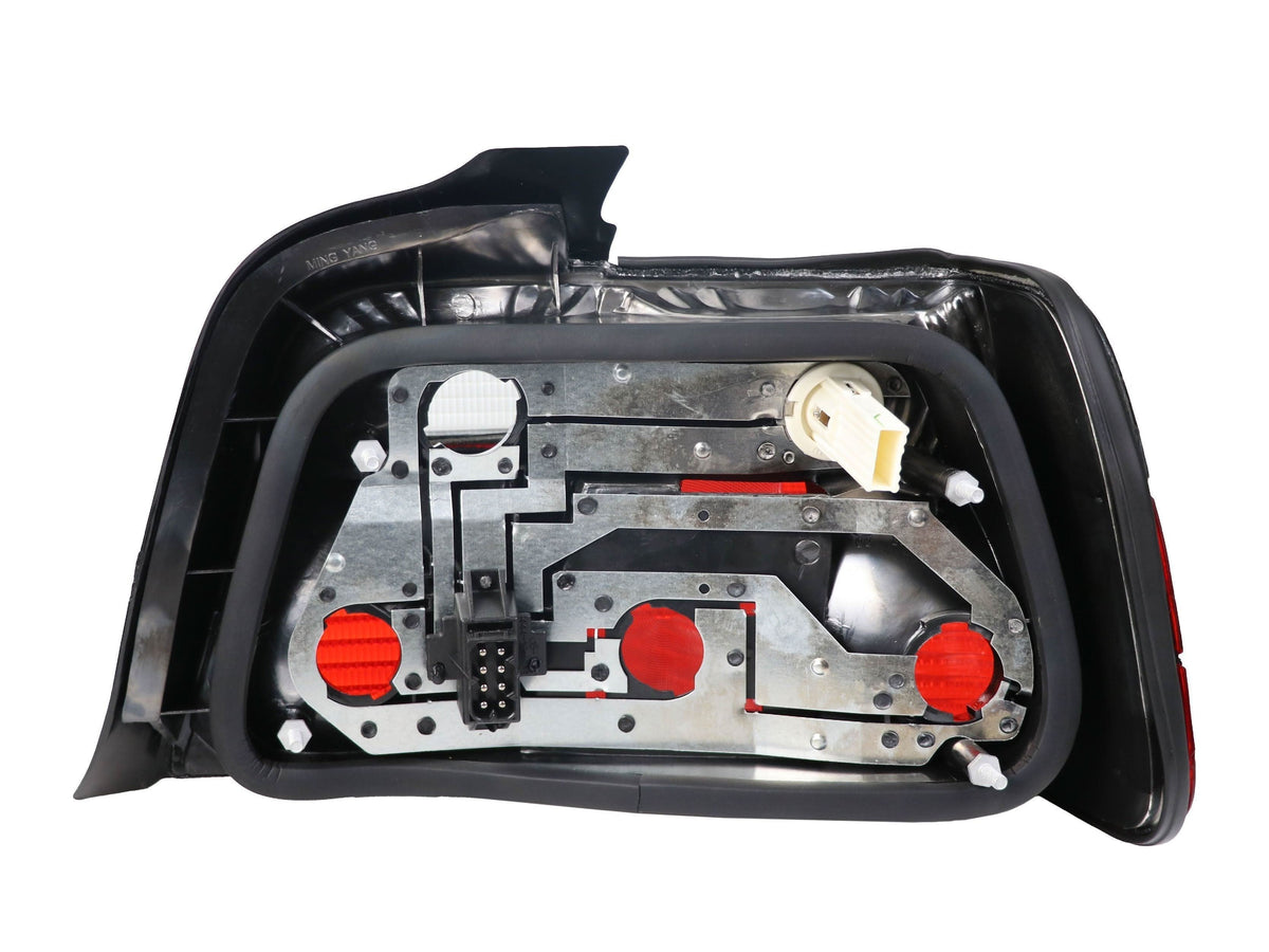 BMW E36 4D tail lights by K2 Industries for 1992-1999 model, showing the sleek red and clear lens design.