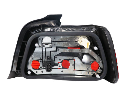 BMW E36 4D tail lights by K2 Industries for 1992-1999 model, showing the sleek red and clear lens design.