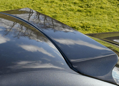 Black BMW E36 Coupe Series 3 HM roof spoiler by K2 Industries, mounted on the car's rear roof with a sleek design.
