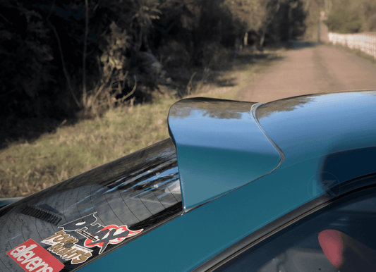 Black BMW E36 Coupe Series 3 HM Roof Spoiler V2 by K2 Industries, side view showing sleek aerodynamic design.