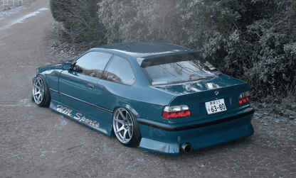 Black BMW E36 Coupe Series 3 HM roof spoiler V2 by K2 Industries, mounted on the car's rear roof area.