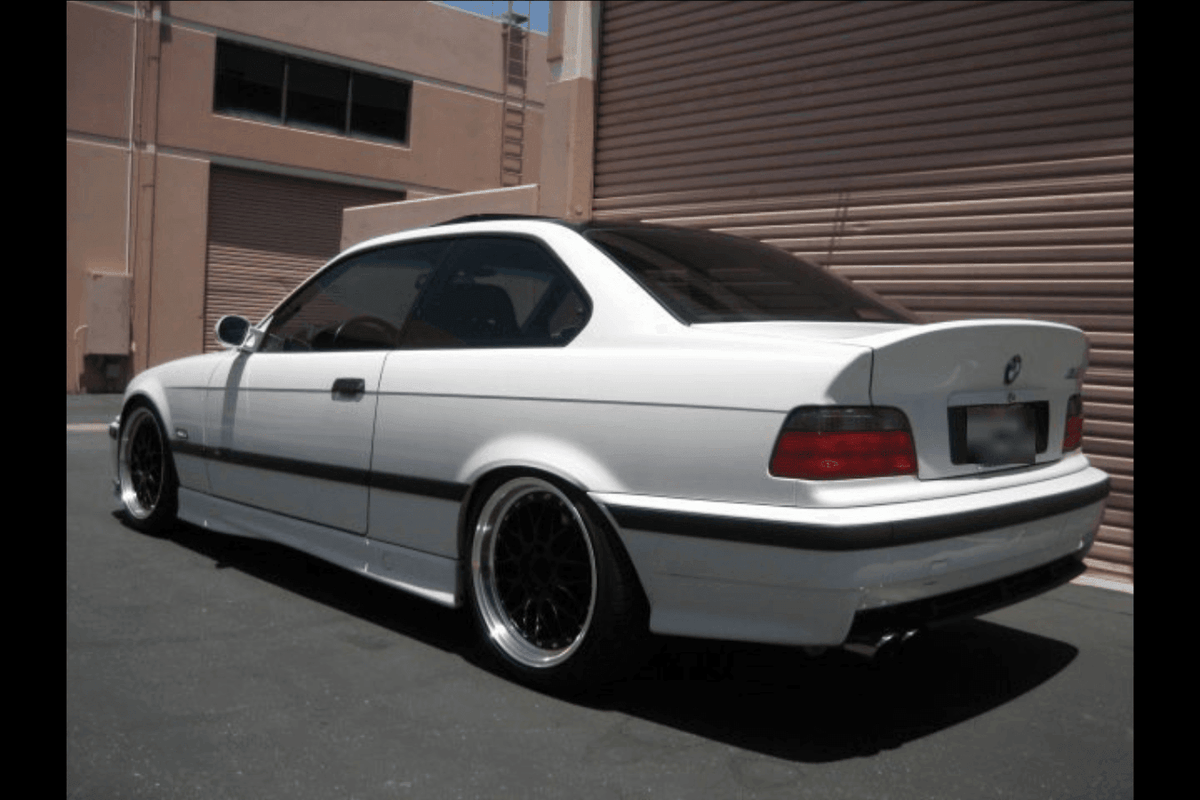 BMW E36 Coupe Series 3 M3 CSL-inspired ducktail trunk spoiler by K2 Industries, designed for 1990-1999 models, installed on car.