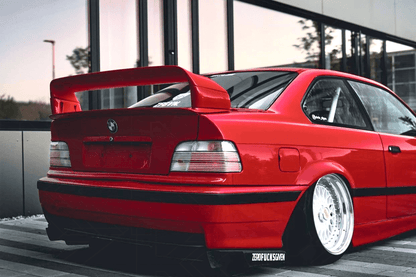 BMW E36 coupe and convertible clear OEM style tail lights by K2 Industries, showing sleek, bright rear lighting design for 1990-1999 models.