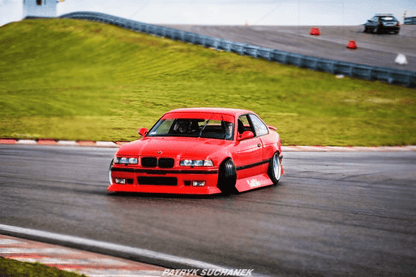 BMW E36 JDM Style Front Lip V2 by K2 Industries installed on a 1992-1999 BMW E36 vehicle, showcasing the sleek front lip design.