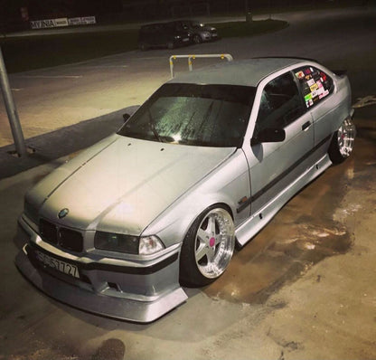 BMW E36 JDM Style Front Lip V2 by K2 Industries, installed on front bumper, showcasing sleek aerodynamic design for 1992-1999 models.
