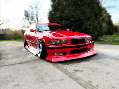 BMW E36 JDM Style Front Lip V2 by K2 Industries installed on the front of a 1992-1999 BMW E36, showcasing sleek design and fitment.