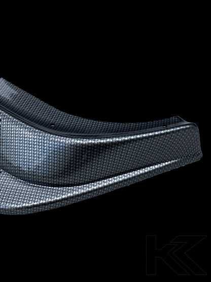 BMW E36 Rieger front lip in carbon style for non-M models, made by K2 Industries, shown on the car's front bumper.