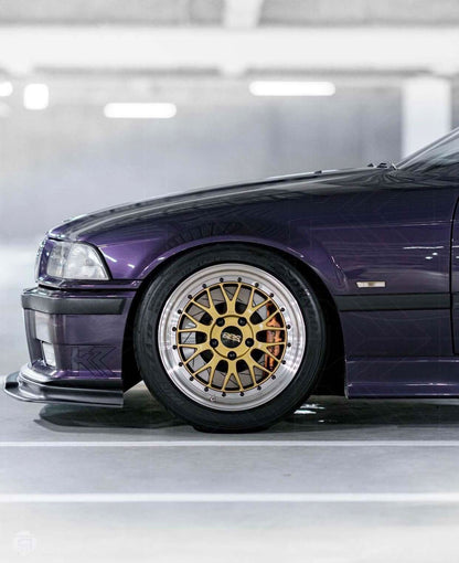 BMW E36 Rieger front lip for M3, made by K2 Industries, shown installed on 1990-1999 BMW E36 model, enhancing sporty front appearance.