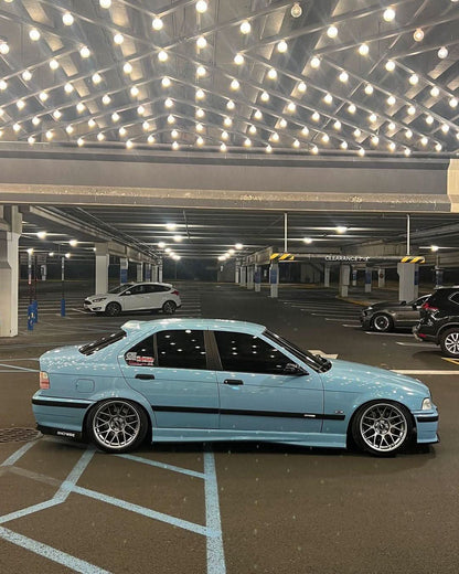 BMW E36 Sedan clear OEM-style tail lights by K2 Industries, showing front and side views of the sleek, transparent tail light design.