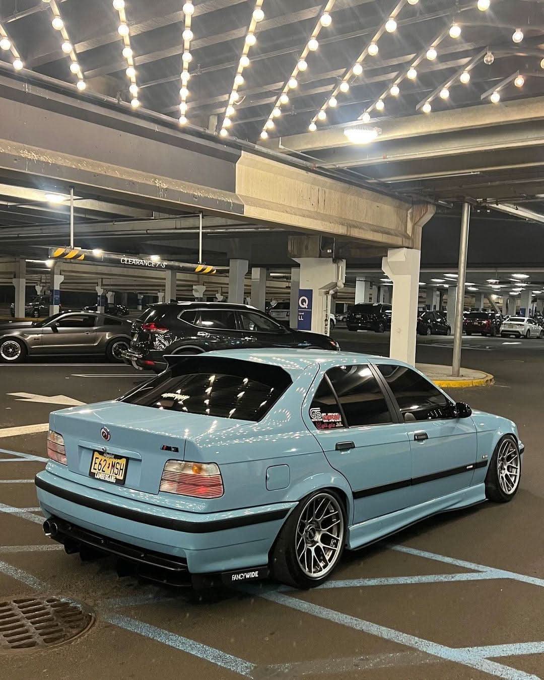 BMW E36 Sedan clear OEM-style tail lights by K2 Industries, showing the sleek, transparent design for 1990-1999 models.