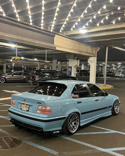 BMW E36 Sedan clear OEM-style tail lights by K2 Industries, showing the sleek, transparent design for 1990-1999 models.