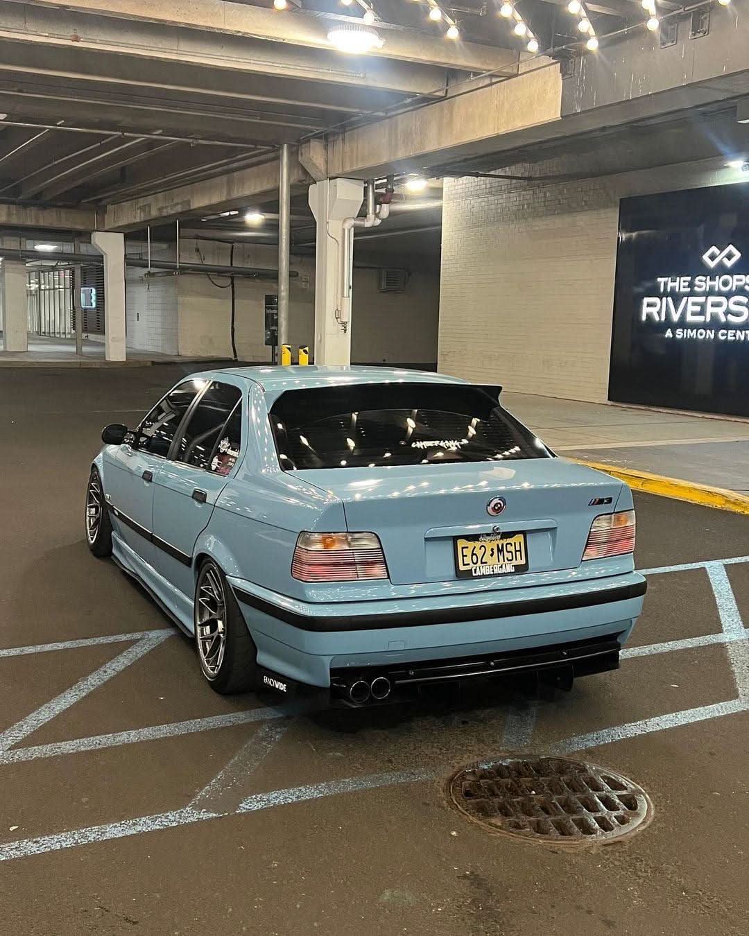 BMW E36 sedan clear OEM-style tail lights by K2 Industries, showing the sleek, transparent design for 1990-1999 models.
