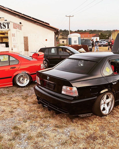 BMW E36 Sedan clear OEM style tail lights by K2 Industries, showing the sleek, transparent design for 1990-1999 models.