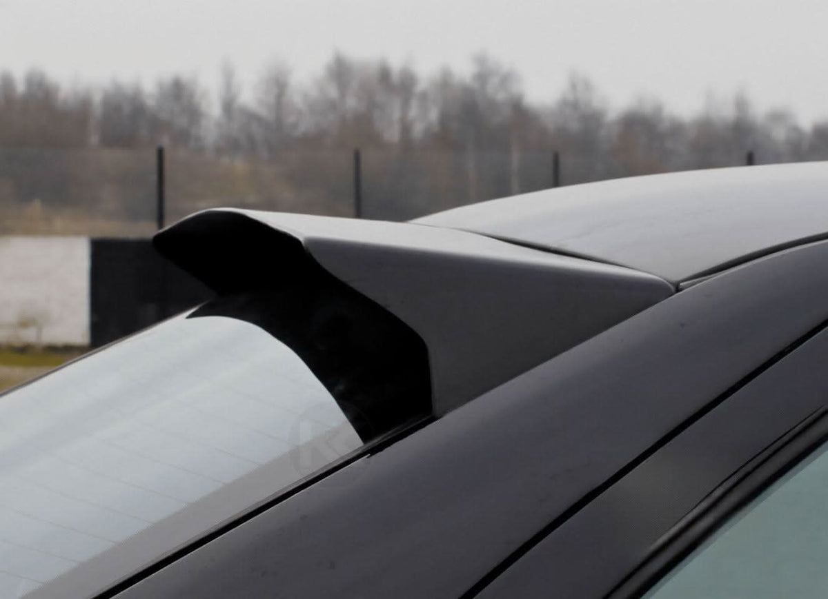Black BMW E36 Sedan Series 3 roof wing by K2 Industries, HM style roof spoiler for 1990-2000 models, mounted on car roof.