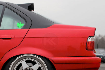 Black BMW E36 Sedan Series 3 roof wing by K2 Industries, HM style roof spoiler mounted on the car's roof, 1990-2000 model.