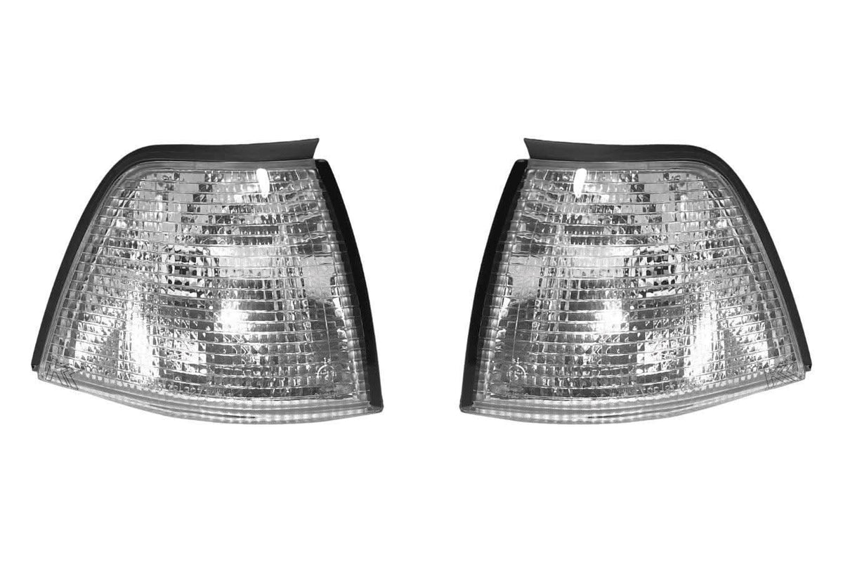 BMW E36 sedan and compact clear corner lights by K2 Industries, front view showing sleek, transparent turn signal lenses.