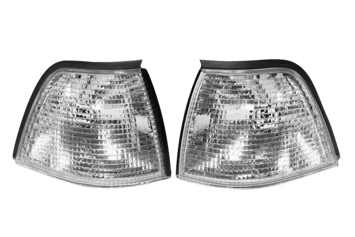 BMW E36 sedan and compact clear corner lights by K2 Industries, designed for 1992-1999 models, showing clean, transparent lens covers.