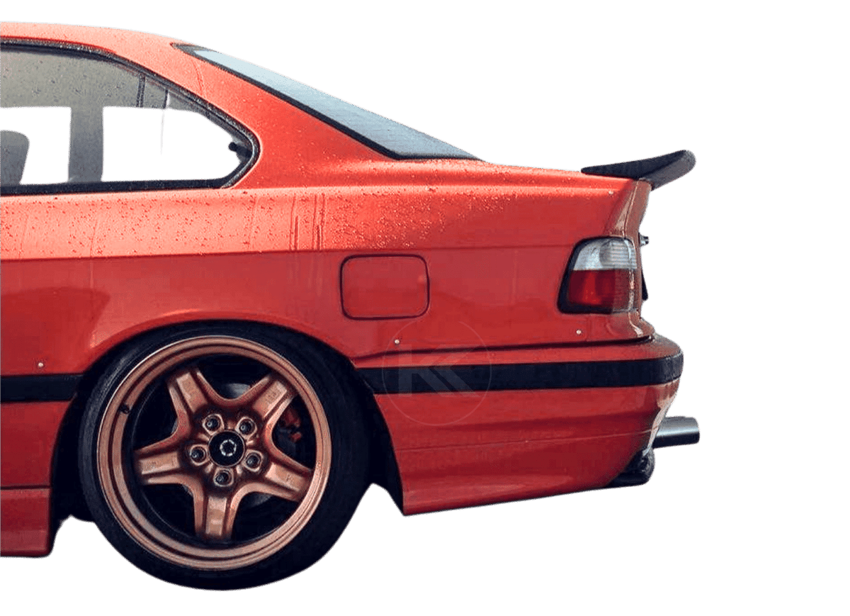 BMW E36 Series 3 drag wing style trunk spoiler by K2 Industries, showing the sleek aerodynamic design on the car's rear.