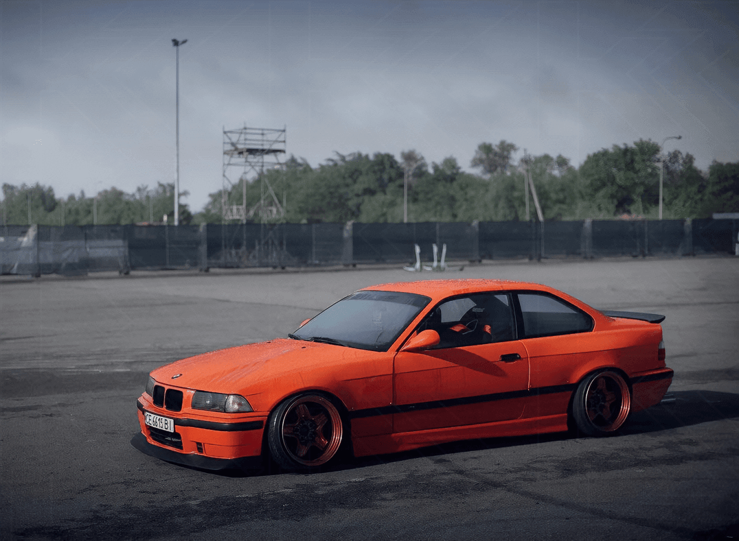 BMW E36 Series 3 drag wing style trunk spoiler by K2 Industries, installed on a 1992-1999 model, shown from side view.