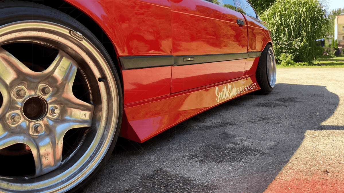 BMW E36 Series 3 JDM Style side skirt by K2 Industries, shown in black, designed for 1992-1999 models, sleek automotive accessory.